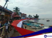 Peringati HUT RI Ke-79, Bendera Merah Putih 200 Meter Dibentangkan di Kawasan Pantai Hiu Paus Botubarani, Bone Bolango